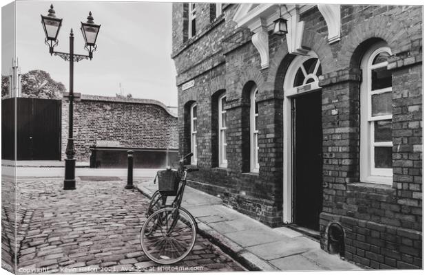 Bicycle in Church Street, Windsor Canvas Print by Kevin Hellon
