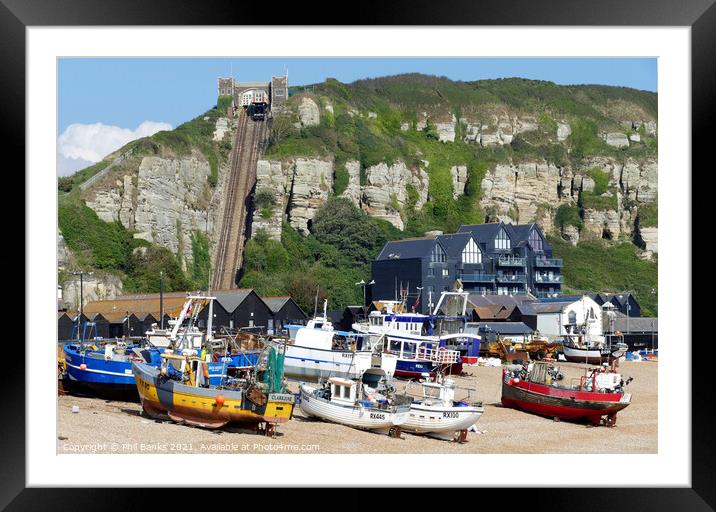 Hastings Beach - Fishing Huts  and boats  Framed Mounted Print by Phil Banks