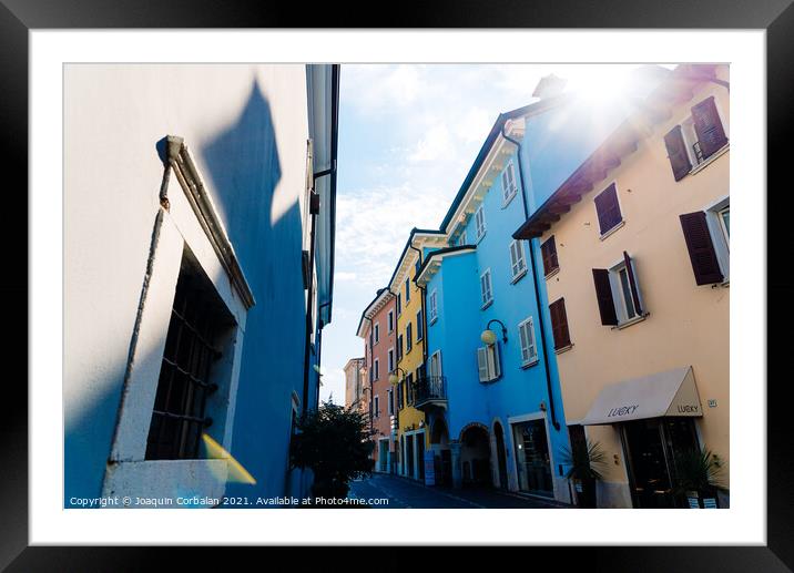 Verona, Italy - September 21, 2021: Nice street of a small Itali Framed Mounted Print by Joaquin Corbalan