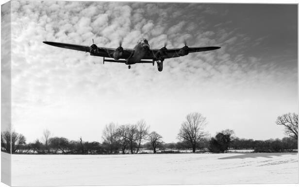Nearly home - Lancaster limping back in winter B&W Canvas Print by Gary Eason