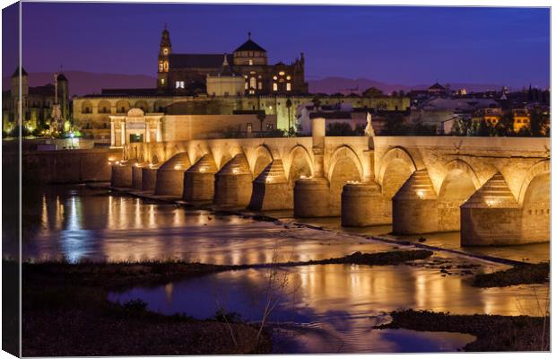 Bridge and Mosque Cathedral of Cordoba at Night Canvas Print by Artur Bogacki