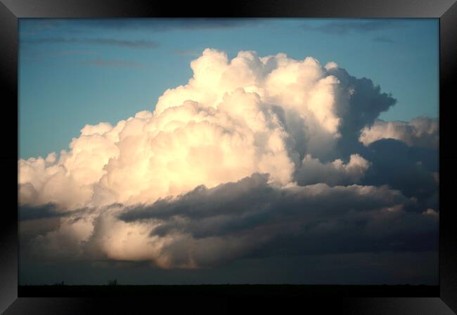 sunlit Thunder cloud Framed Print by Simon Johnson