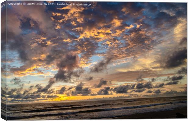 Color play of sun and clouds on the beach Canvas Print by Lucas D'Souza