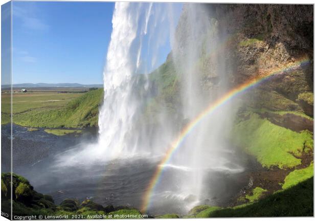 Rainbow in front of Seljalandsfoss waterfall, Iceland Canvas Print by Lensw0rld 