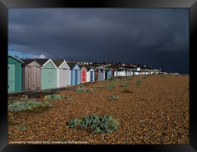 Beach Huts bathed in Sunshine and Rain. Framed Print by Mark Ward