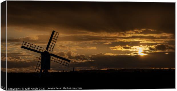 Windmill silhouette at dusk Canvas Print by Cliff Kinch