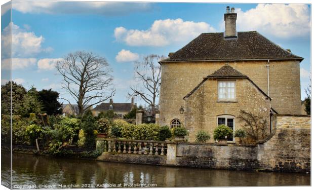 Stone Built House On The Bank Of The River Windrush Canvas Print by Kevin Maughan