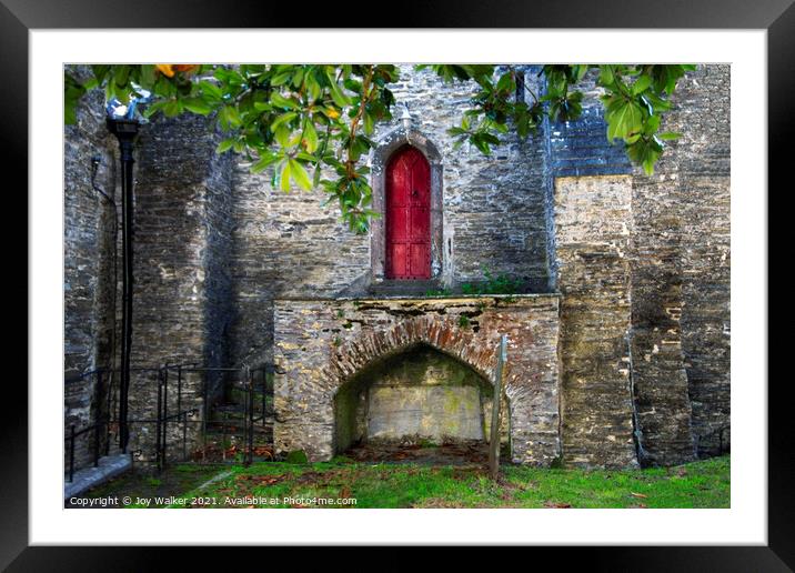 A small red church door located in Padstow, Cornwall, UK Framed Mounted Print by Joy Walker