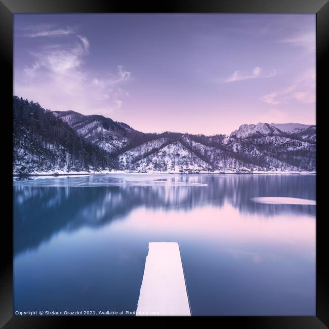 Gramolazzo iced lake and snowy pier in Apuan mountains. Italy Framed Print by Stefano Orazzini