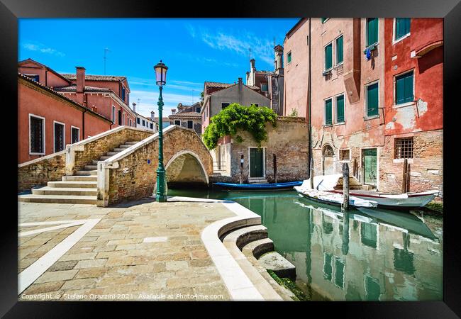 Venice cityscape, canal, bridge and traditional buildings. Framed Print by Stefano Orazzini