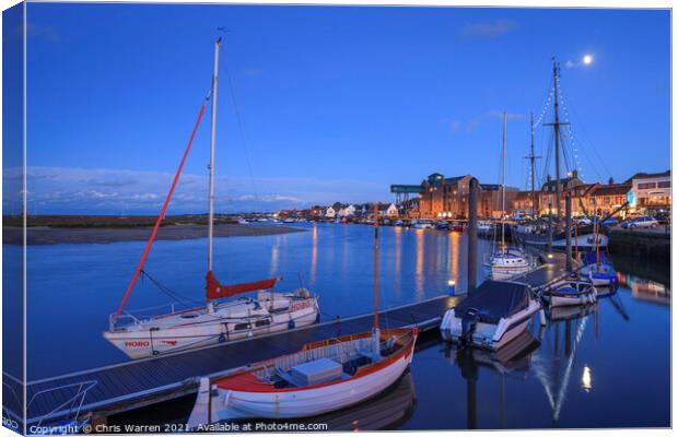 Boats moored in the evening light at Wells-next-t Canvas Print by Chris Warren