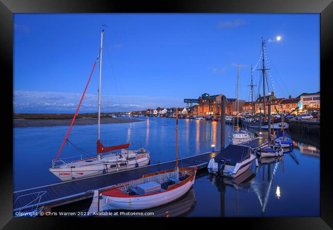 Boats moored in the evening light at Wells-next-t Framed Print by Chris Warren