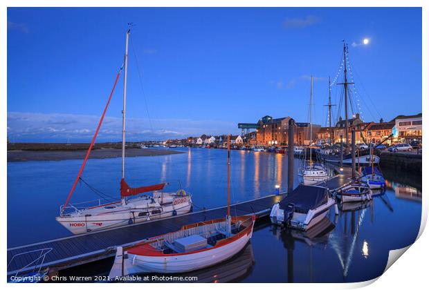 Boats moored in the evening light at Wells-next-t Print by Chris Warren
