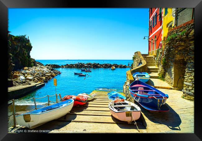 Riomaggiore village, boats and sea. Cinque Terre, Italy, Framed Print by Stefano Orazzini