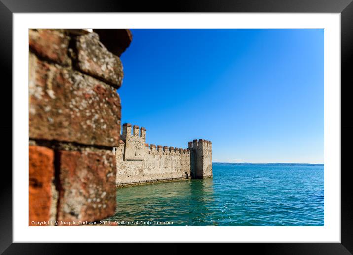 Facade of the castle of Sirmione surrounded by water. Framed Mounted Print by Joaquin Corbalan