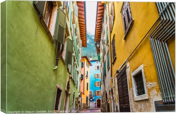 Narrow and colorful streets in a typical Italian village on the  Canvas Print by Joaquin Corbalan