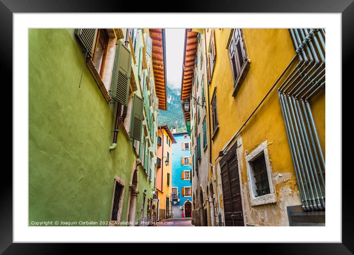 Narrow and colorful streets in a typical Italian village on the  Framed Mounted Print by Joaquin Corbalan