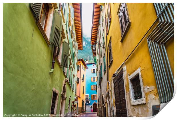 Narrow and colorful streets in a typical Italian village on the  Print by Joaquin Corbalan