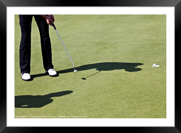 Golf putt Framed Mounted Print by Raymond Evans