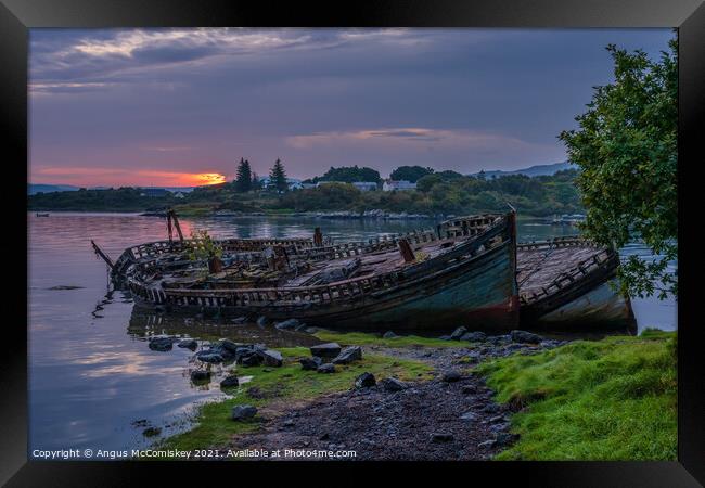 Abandoned fishing boats at Salen Bay at daybreak Framed Print by Angus McComiskey