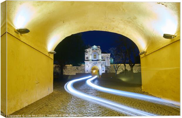 Elvas gate city entrance at night with car light trail in Alentejo, Portugal Canvas Print by Luis Pina