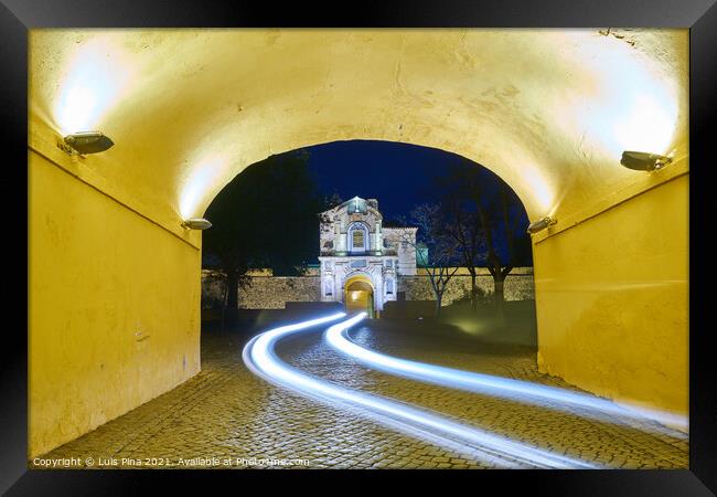 Elvas gate city entrance at night with car light trail in Alentejo, Portugal Framed Print by Luis Pina