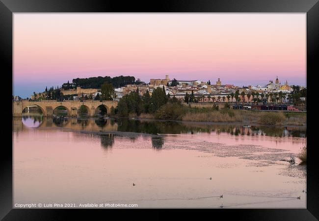 Badajoz city at sunset with river Guadiana in Spain Framed Print by Luis Pina