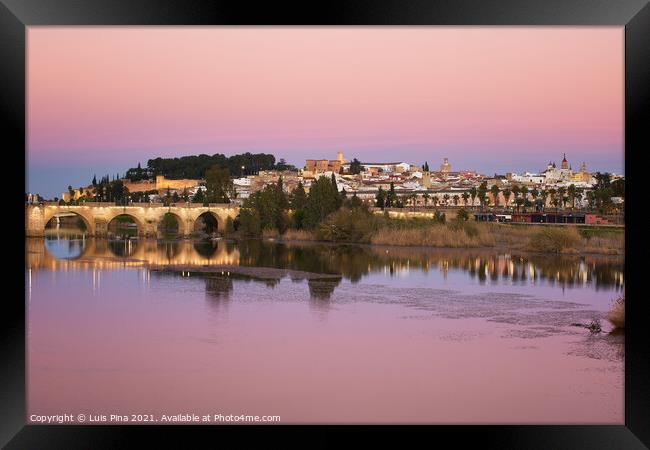Badajoz city at sunset with river Guadiana in Spain Framed Print by Luis Pina