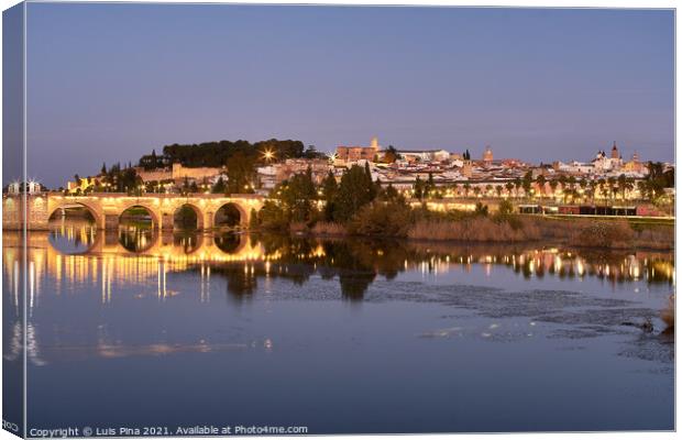 Badajoz city at night with river Guadiana in Spain Canvas Print by Luis Pina