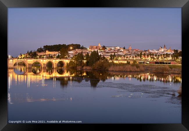Badajoz city at night with river Guadiana in Spain Framed Print by Luis Pina