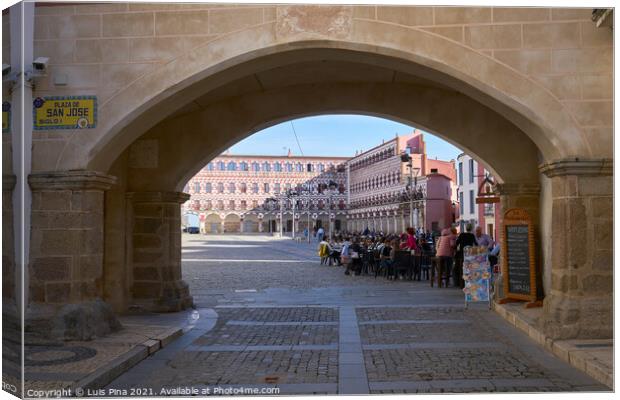 Plaza alta entrance with tourists on the tapas bars and arabic type buildings in Badajoz, Spain Canvas Print by Luis Pina