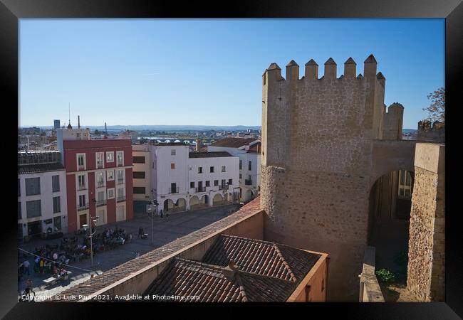 Plaza Alta red and white buildings view from city castle in Badajoz, Spain Framed Print by Luis Pina