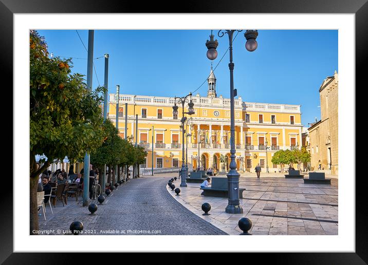 Plaza de Espana beautiful yellow building with tourists on the bars in Badajoz, Spain Framed Mounted Print by Luis Pina