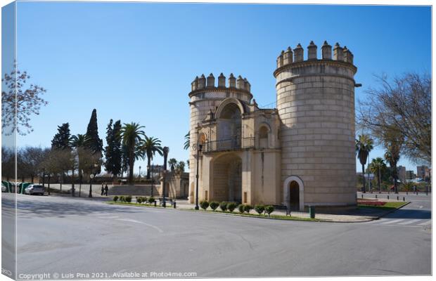 Puerta de Palmas entrance towers on a middle of a road in Badajoz, Spain Canvas Print by Luis Pina