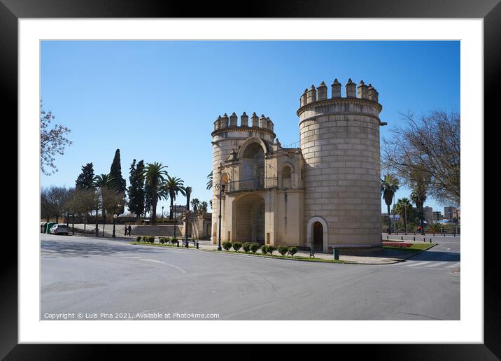 Puerta de Palmas entrance towers on a middle of a road in Badajoz, Spain Framed Mounted Print by Luis Pina
