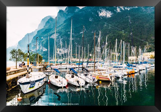 Riva del Garda, Italy - October 2, 2021: Boats and yachts moored Framed Print by Joaquin Corbalan
