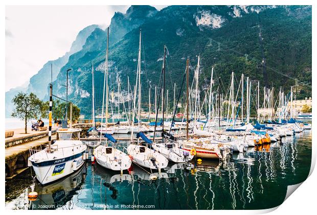 Riva del Garda, Italy - October 2, 2021: Boats and yachts moored Print by Joaquin Corbalan