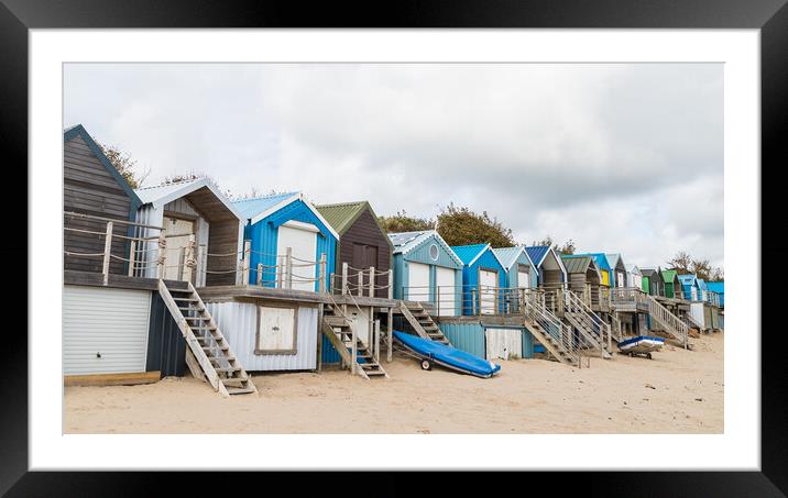 Abersoch beach huts lined up Framed Mounted Print by Jason Wells