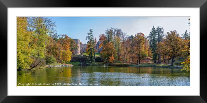 View of lake and medieval castle in autumn.  Framed Mounted Print by Maria Vonotna