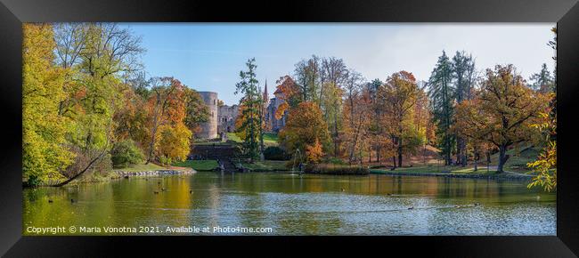 View of lake and medieval castle in autumn.  Framed Print by Maria Vonotna