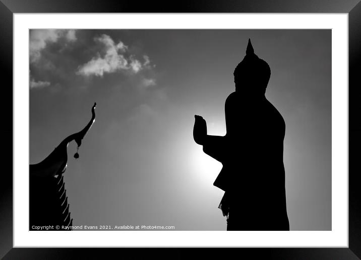Buddha statue Silhouette Framed Mounted Print by Raymond Evans