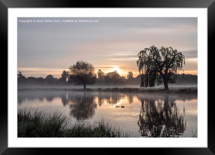 Calm waters at sunrise Framed Mounted Print by Kevin White