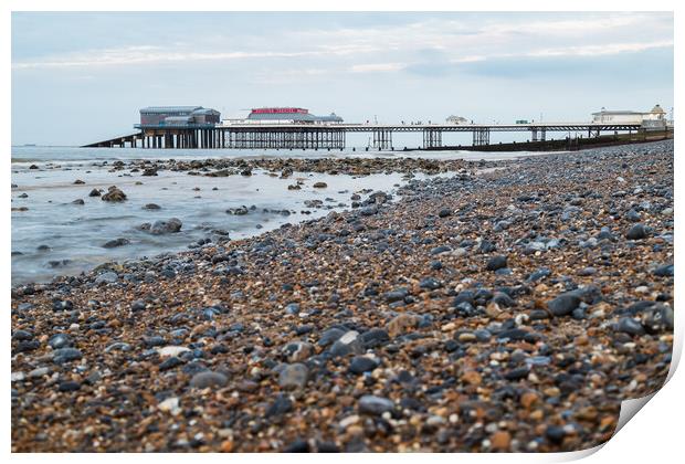 Cromer Pier seen over the shingle beach Print by Jason Wells