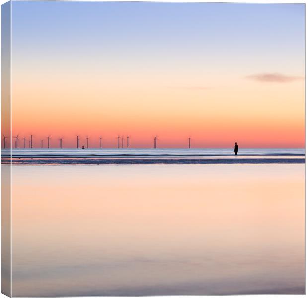 Square crop of an Iron Man watching the spinning turbines on Bur Canvas Print by Jason Wells