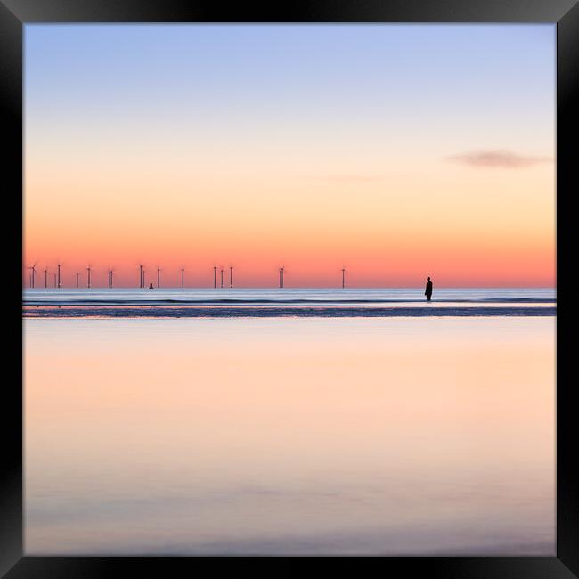 Square crop of an Iron Man watching the spinning turbines on Bur Framed Print by Jason Wells