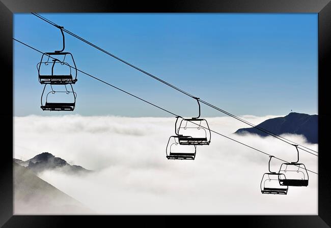 Empty Chairlift above the Clouds Framed Print by Arterra 