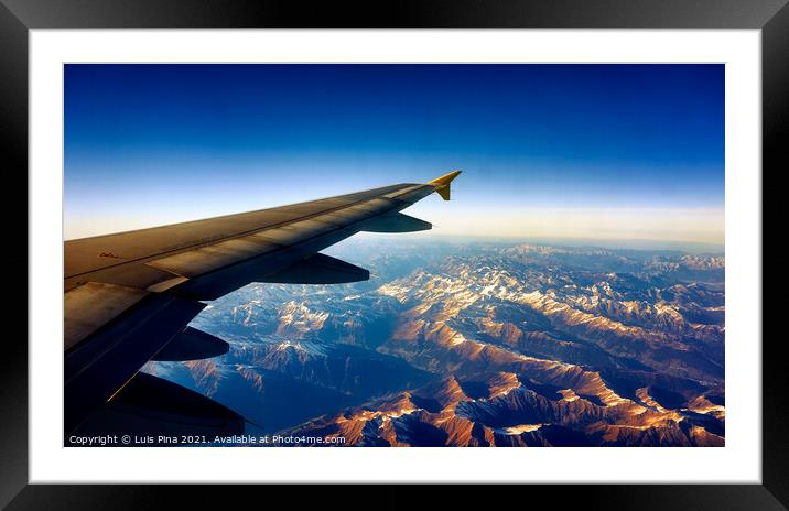 View from Airplane Window on a mountain landscape with snow and airplane wing Framed Mounted Print by Luis Pina