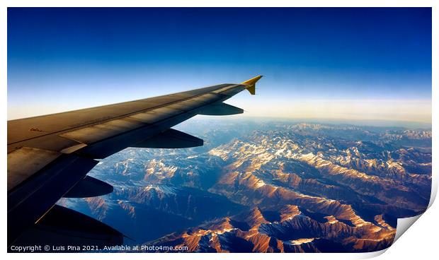 View from Airplane Window on a mountain landscape with snow and airplane wing Print by Luis Pina