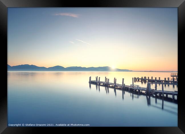 Three Wooden piers at sunrise. Torre del Lago Puccini. Framed Print by Stefano Orazzini