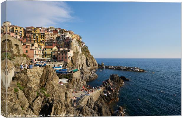 Manarola beach and city view in Cinque Terre, in Italy Canvas Print by Luis Pina